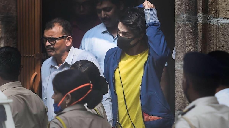 Aryan Khan (in yellow shirt, blue jacket) taken to court by police